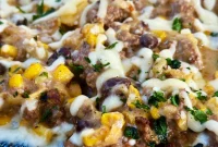 Blackstone Beef Enchiladas with Melted Cheese and Salsa Verde