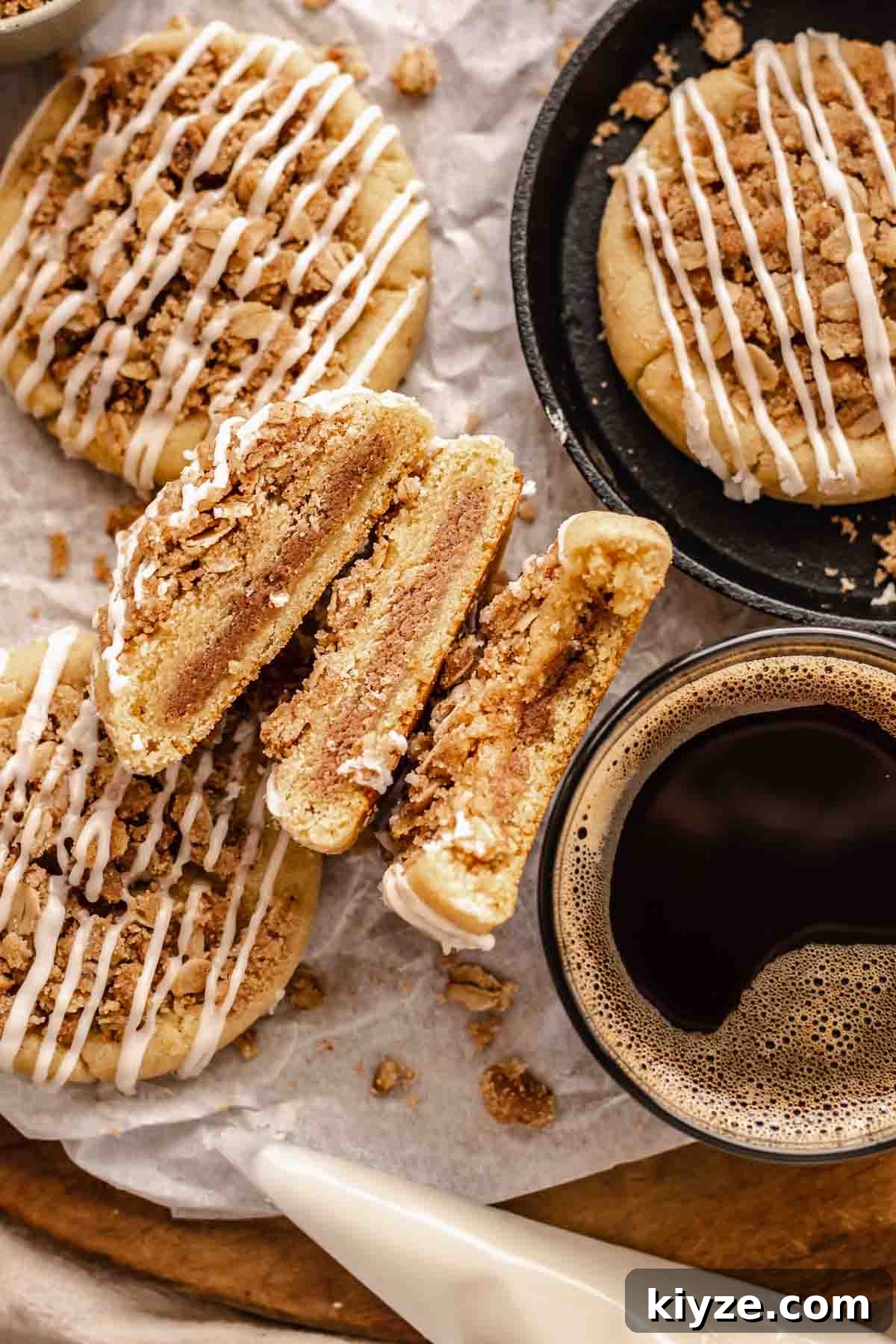 Cinnamon Swirl Coffee Cake Cookies: Soft Baked Recipe 2 Coffee cake cookies cut in half next to a cup of coffee.