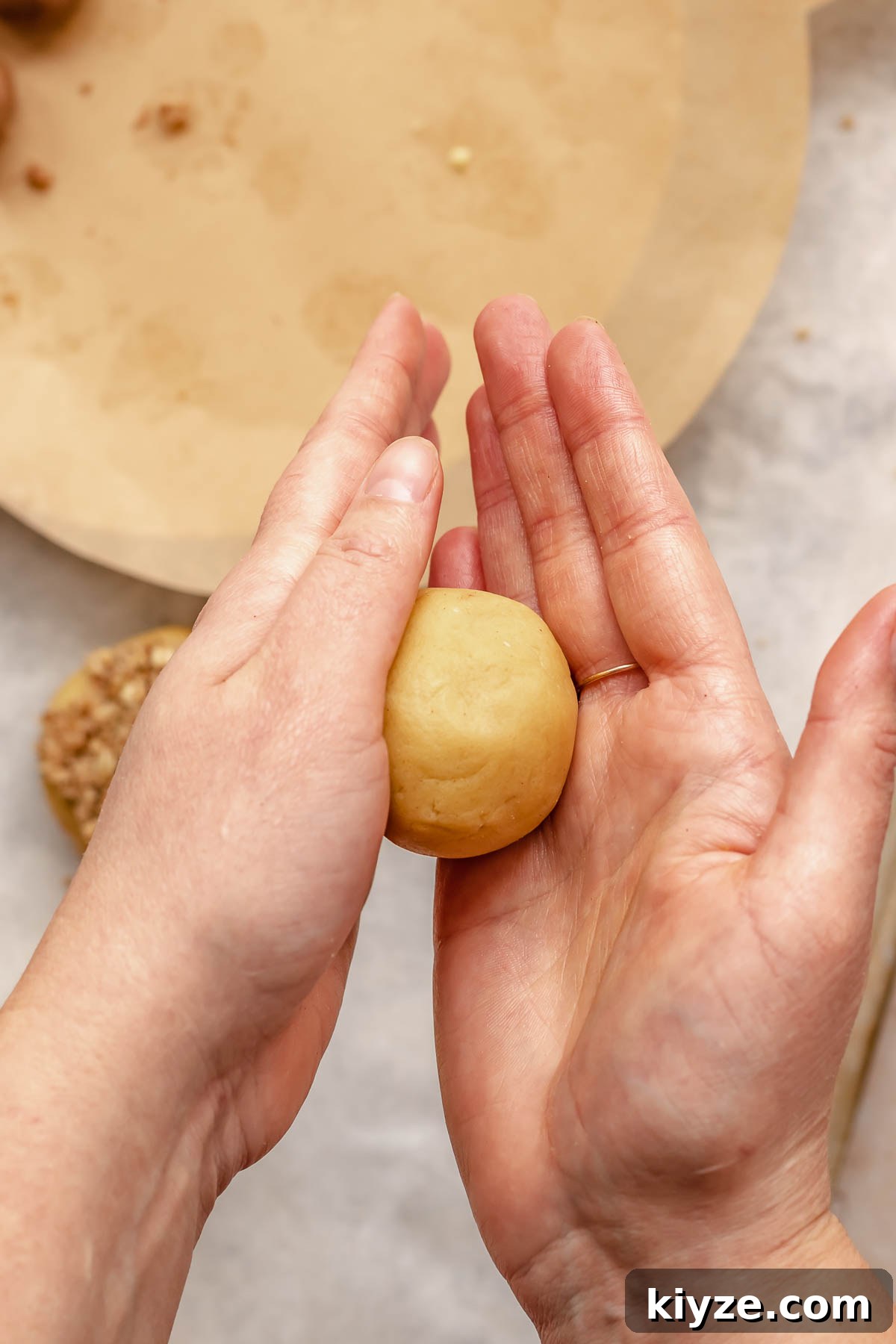 Cinnamon Swirl Coffee Cake Cookies: Soft Baked Recipe 14 Hands roll a cookie dough ball.