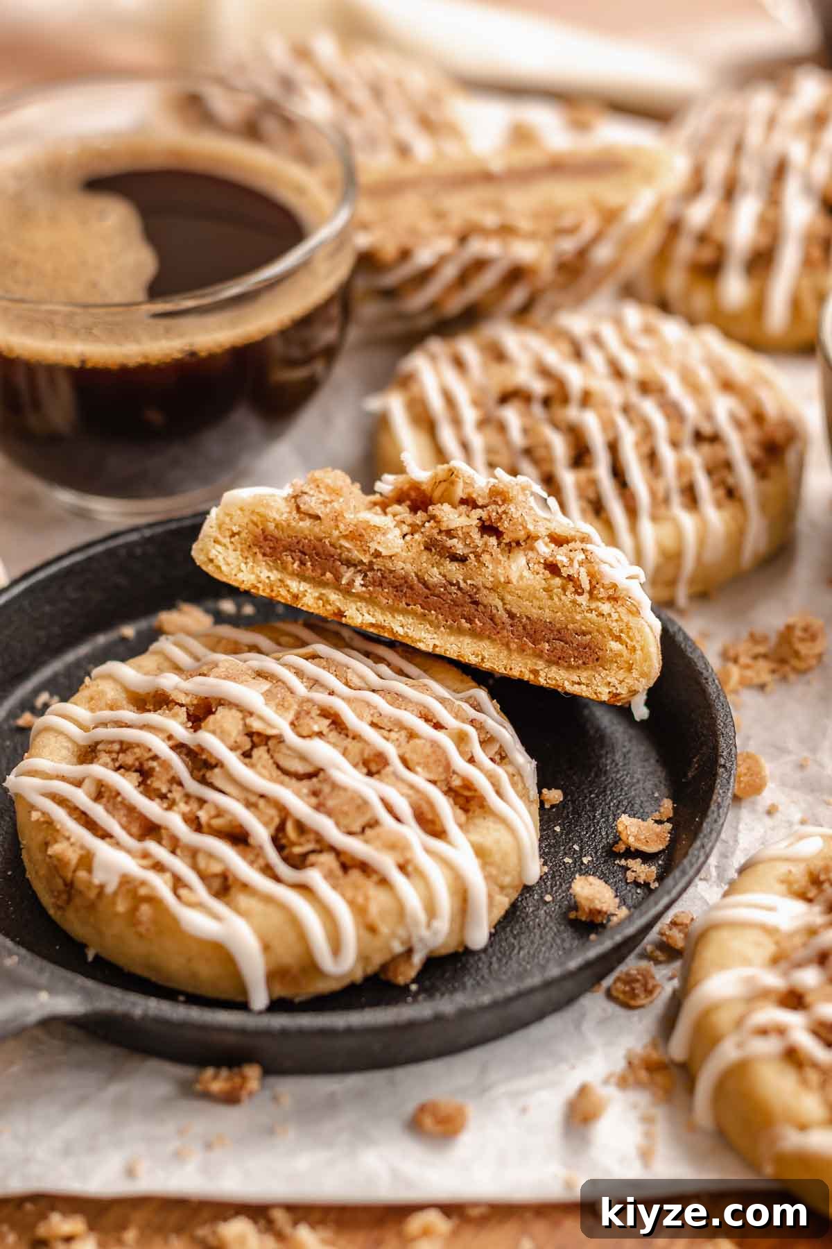 Cinnamon Swirl Coffee Cake Cookies: Soft Baked Recipe 20 Coffee cake cookies. One is cut in half to show the center.