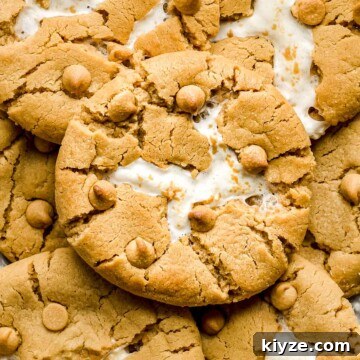 Fluffernutter cookie layered on other cookies with the crack exposed.