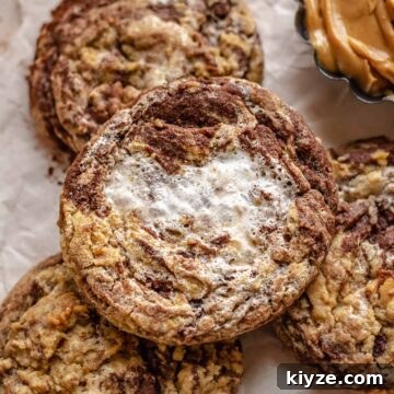 Peanut butter marshmallow chocolate cookie on top of cookies.