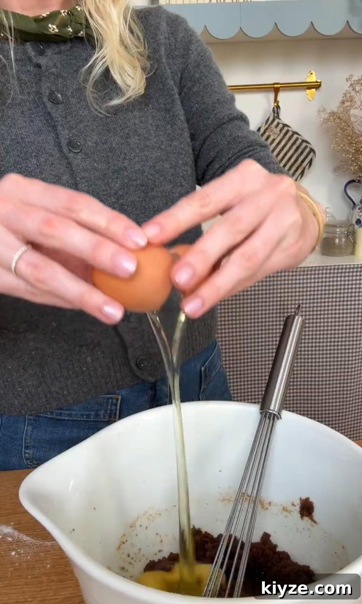Soft, Chewy Chocolate-Free Cookies: Simple Homemade Recipe 6 adding eggs to cookie dough.