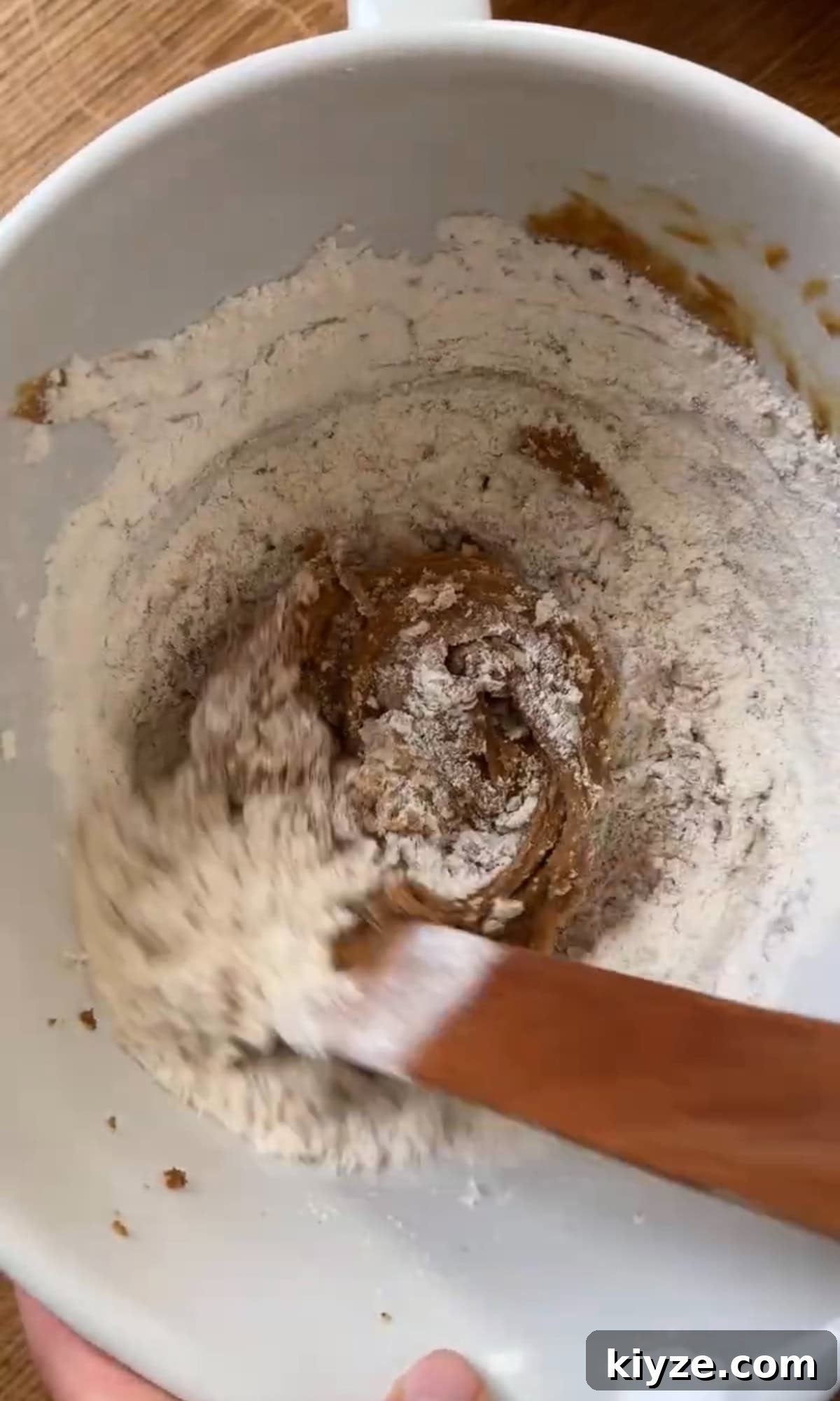 Soft, Chewy Chocolate-Free Cookies: Simple Homemade Recipe 7 mixing flour into cookie dough.