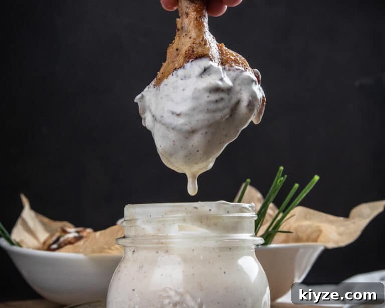 Chicken drum stick dipped in Alabama white sauce