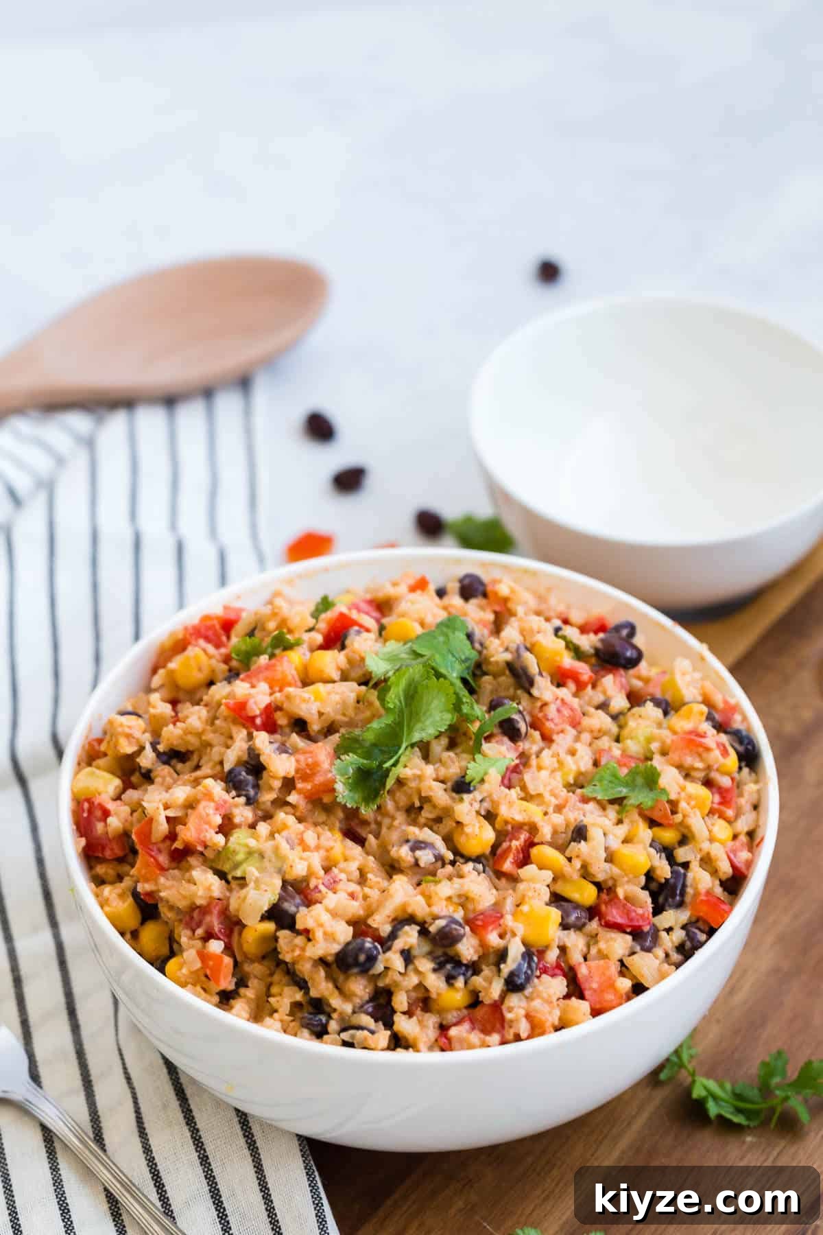 Cauliflower Rice Enchilada Bowl with Shredded Chicken & Salsa Verde 5 Cauliflower rice enchilada bowl topped with fresh cilantro.