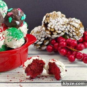 red velvet brownie bite split in half with dish of red velvet brownie bites in the background