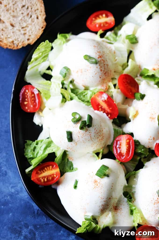 Polish Deviled Eggs with Classic Mayonnaise Filling 12 Eggs Mayonnaise on a black plate with bread behind