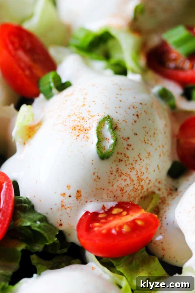 Polish Deviled Eggs with Classic Mayonnaise Filling 4 Close up photo of Eggs Mayonnaise with cherry tomatoes and scallions