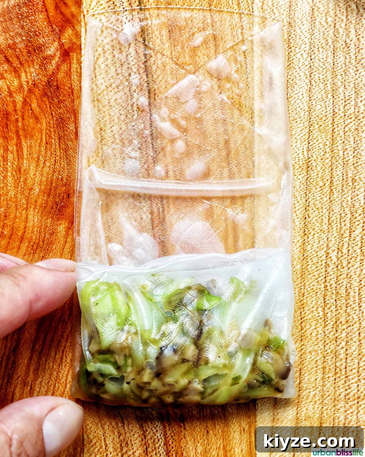 Crispy Rice Paper Dumplings with Savory Filling and Dipping Sauce 11 vegetable filling on top of a rice paper wrapper being folded.
