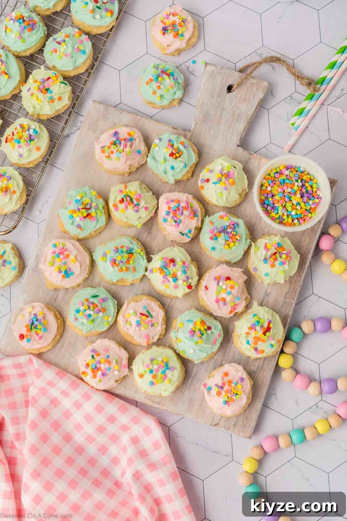 Sour Cream Sugar Cookies Recipe for Soft, Tender Cookies 15 Sugar cookies frosted and topped with sprinkles.