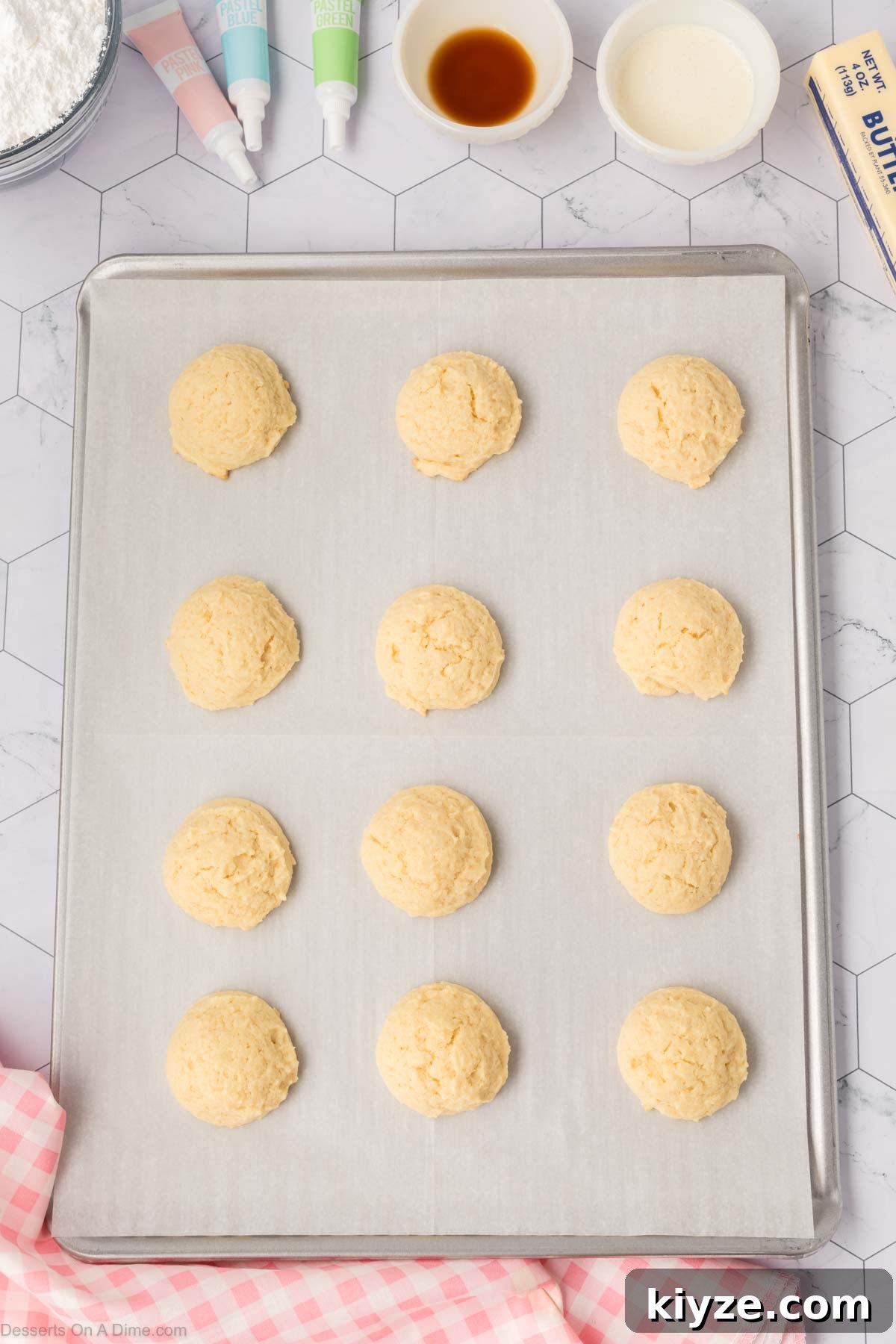 Sour Cream Sugar Cookies Recipe for Soft, Tender Cookies 10 Cookie dough balls on a baking sheet.