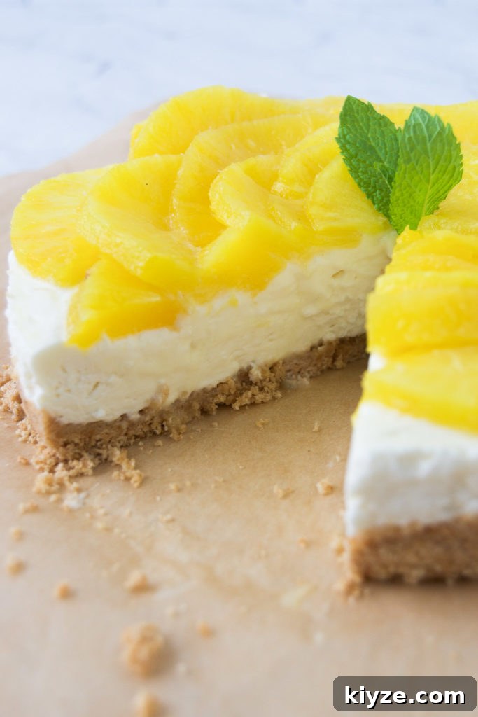 No-Bake Pineapple Cheesecake Recipe with Creamy Tropical Filling 12 A no bake pineapple cheesecake missing a slice.