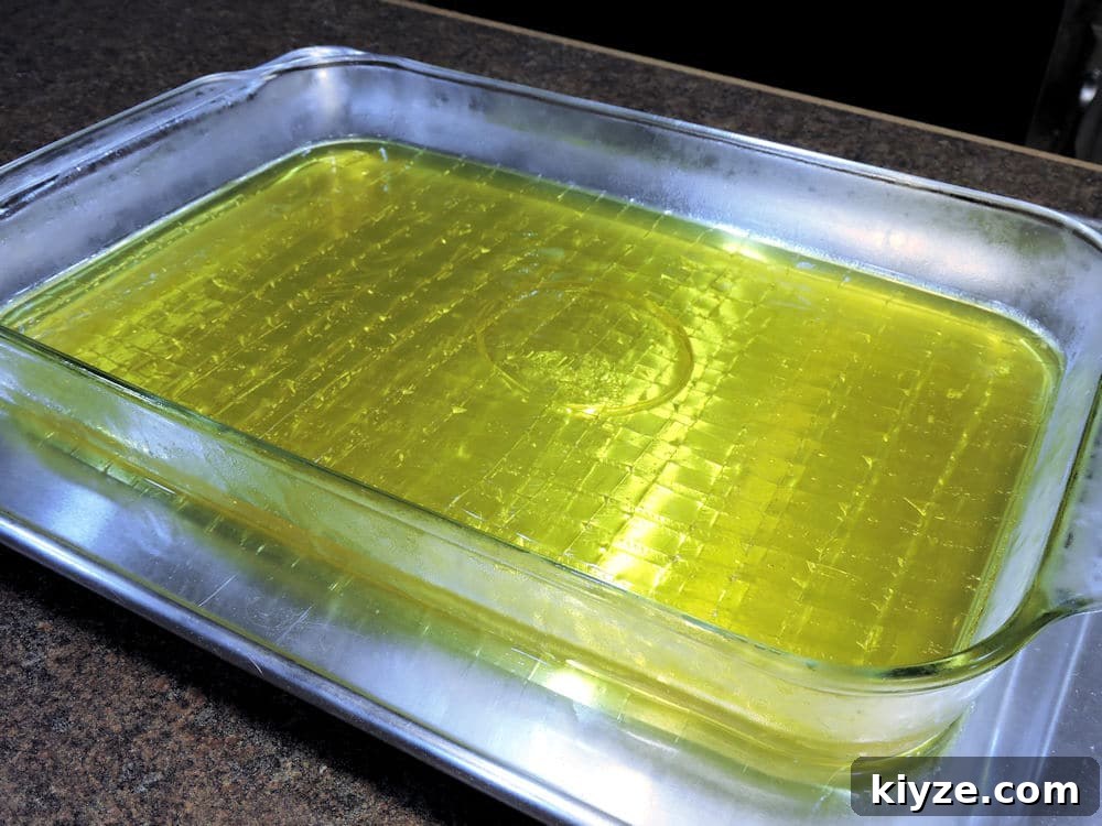 Citrus Jello Fluff Salad with Lemon and Orange Zest 6 refrigerated lemon jello squares ready for cutting.