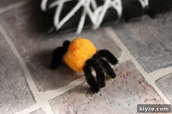 Spider and Web Craft Activities to Boost Preschool Fine Motor Skills 7 pom pom spider