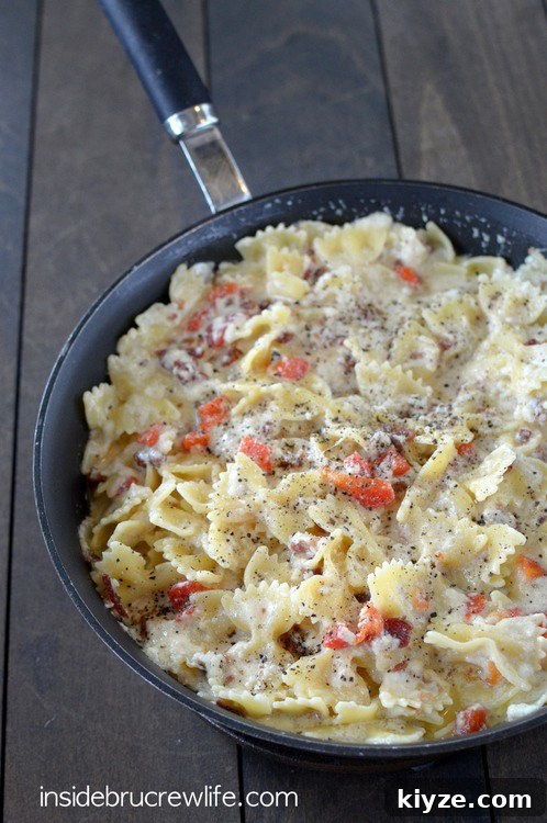 Bacon Shrimp Alfredo Pasta photo Easy homemade Alfredo sauce that can be made in minutes. Bacon, red peppers, and popcorn shrimp make this pasta taste amazing!