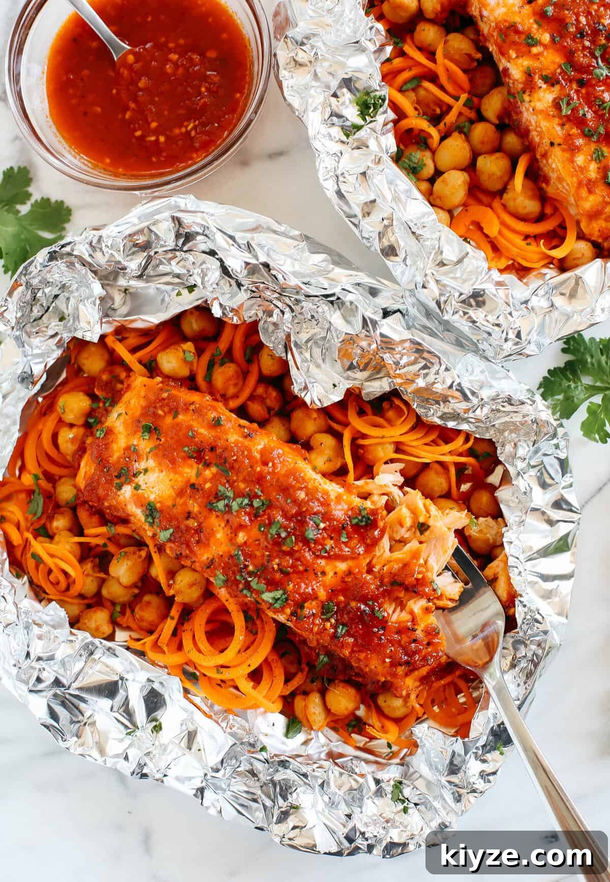 Moroccan Salmon Foil Packets with Carrot Noodles & Chickpeas 2 These Moroccan Salmon Foil Packets with Carrot Noodles & Chickpeas are sweet and spicy with tons of flavor and are easily made in just 20 minutes with little to no clean-up!