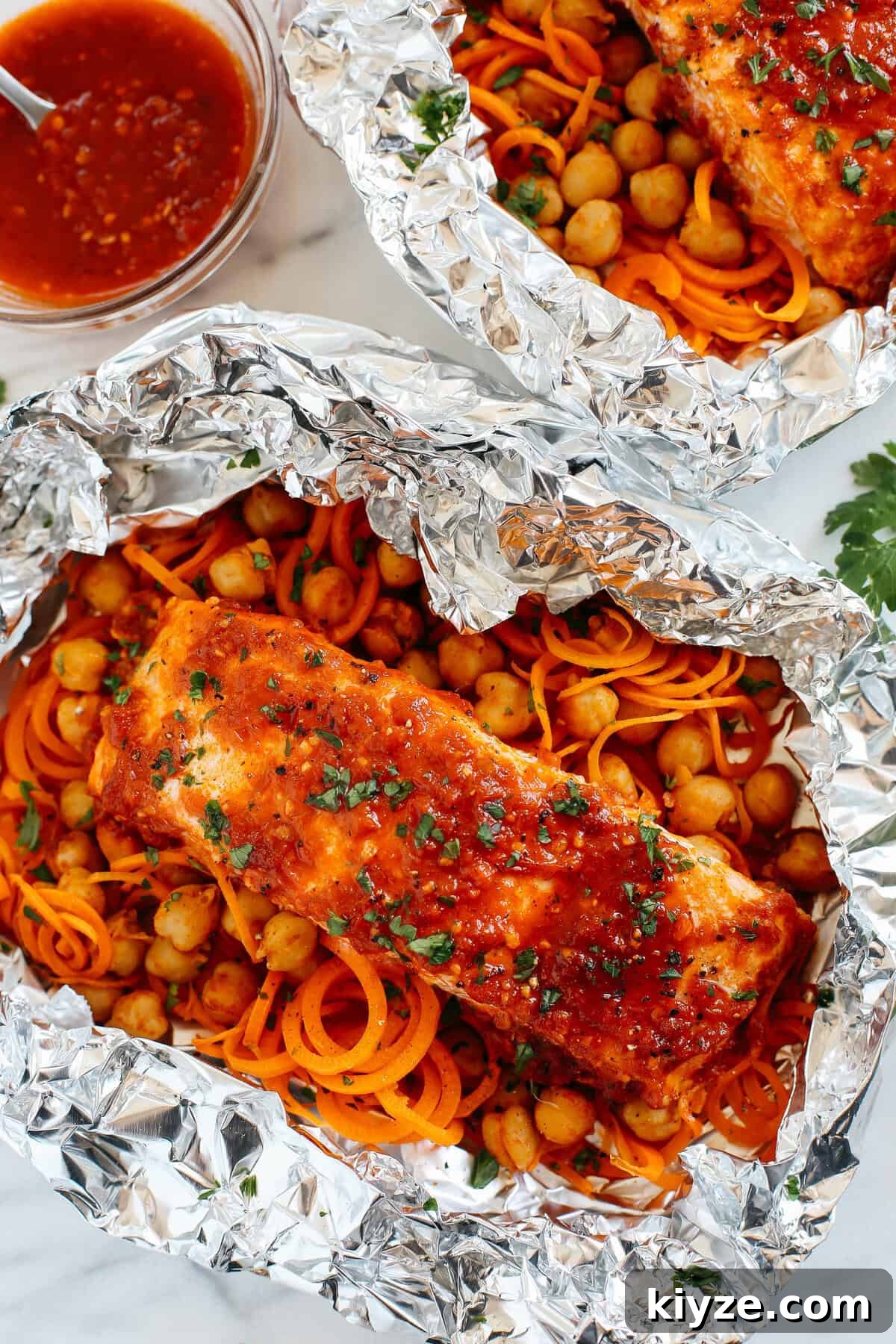 Moroccan Salmon Foil Packets with Carrot Noodles & Chickpeas 3 These Moroccan Salmon Foil Packets with Carrot Noodles & Chickpeas are sweet and spicy with tons of flavor and are easily made in just 20 minutes with little to no clean-up!