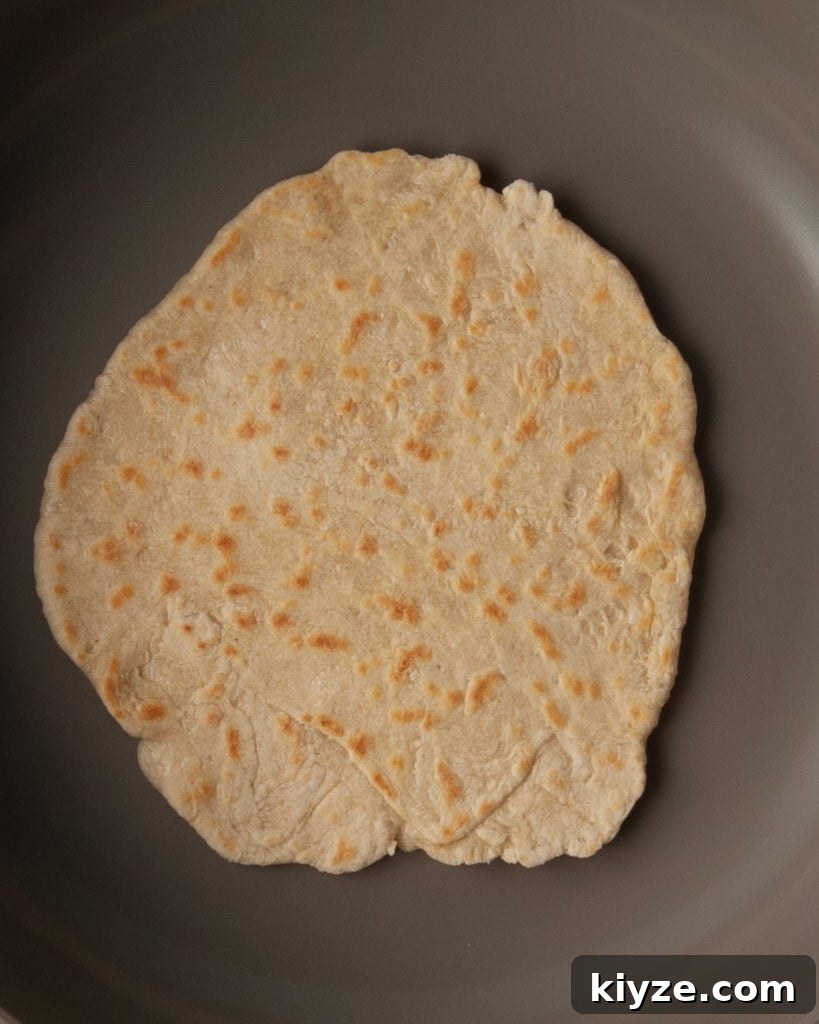 Tortilla frying in a pan.