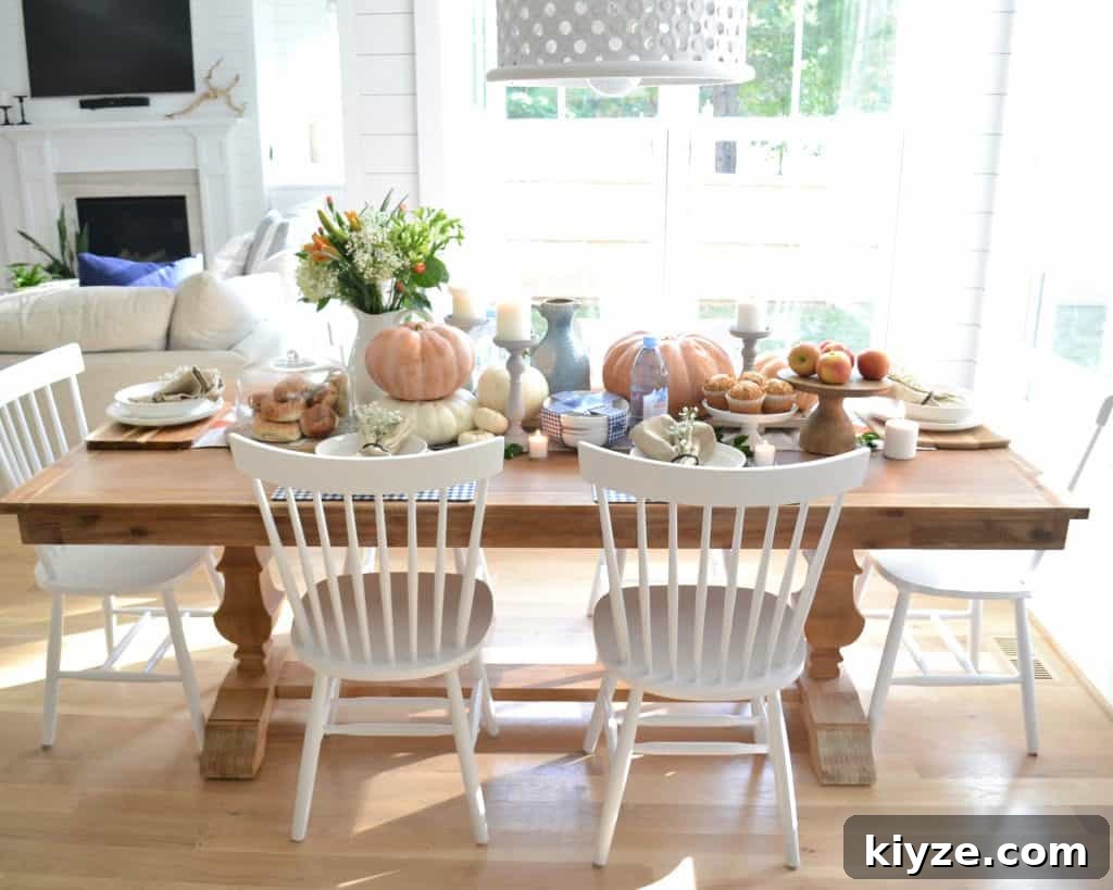 Fall Tablescape Ideas You Can Recreate at Home 9 long table covered in pumpkins and food and home decor