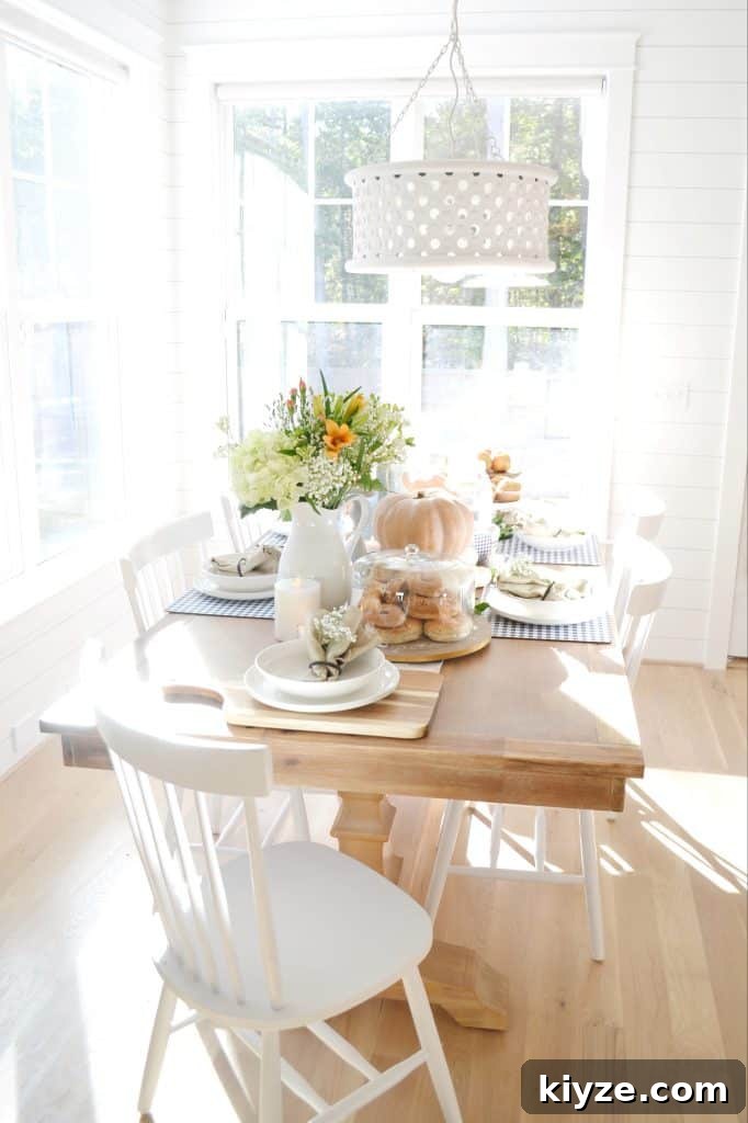 Fall Tablescape Ideas You Can Recreate at Home 3 a pumpkin tablescape for fall entertaining under a big white light