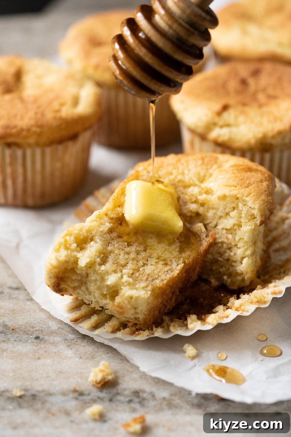 Keto Cornbread Muffins (1g Net Carb Each) 5 Drizzling keto maple syrup onto a halved low carb cornbread muffin