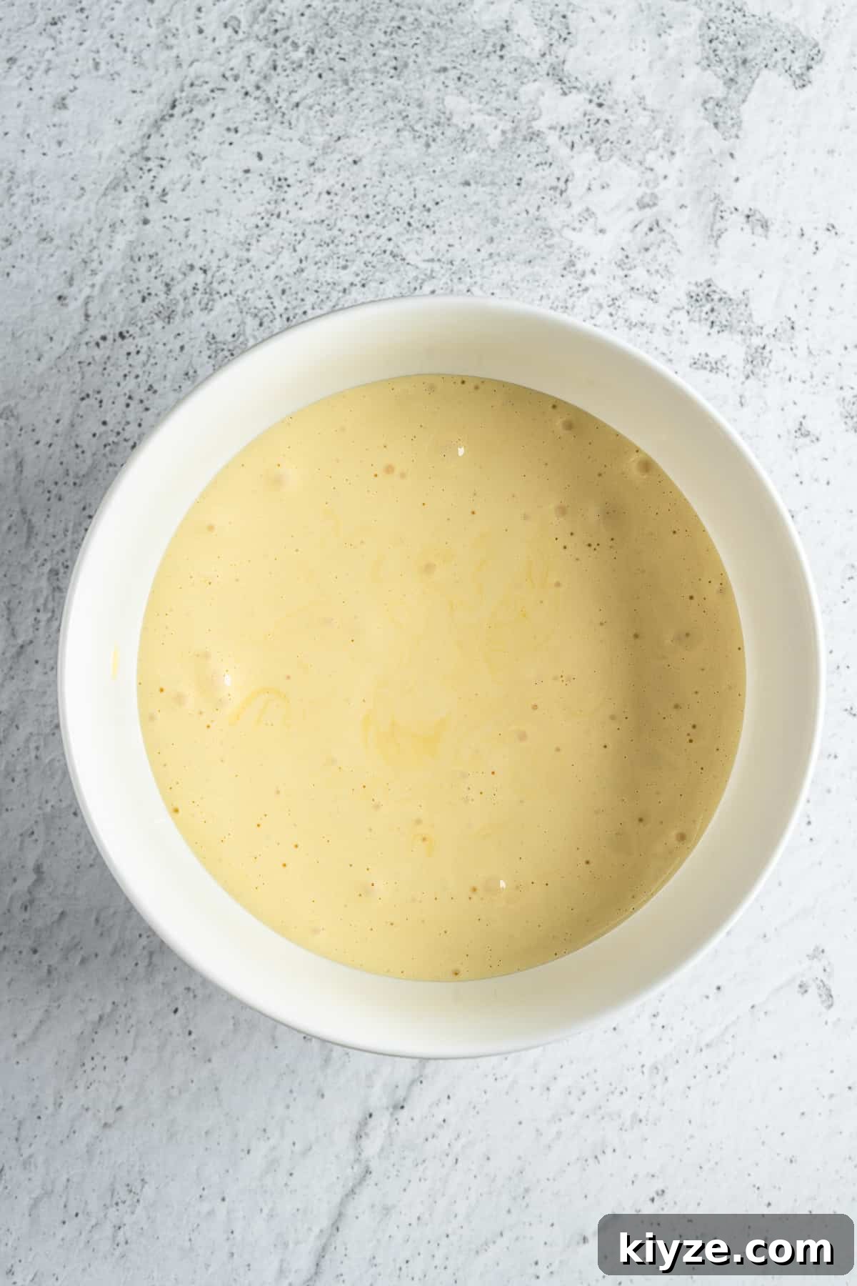 Classic Tiramisu with Marsala and Mascarpone Recipe 4 Beaten egg yolks with sugar in a bowl.