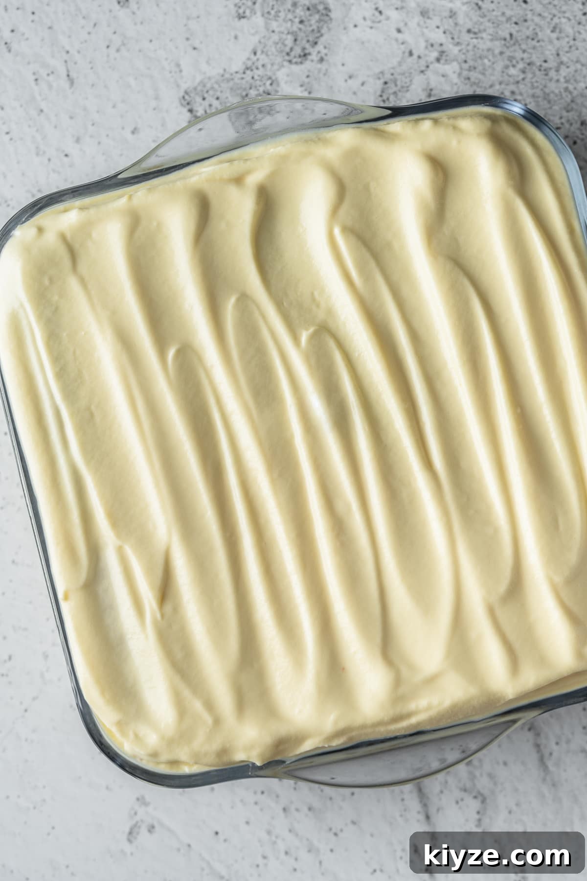 Classic Tiramisu with Marsala and Mascarpone Recipe 8 Assembled Italian tiramisu in a glass dish.
