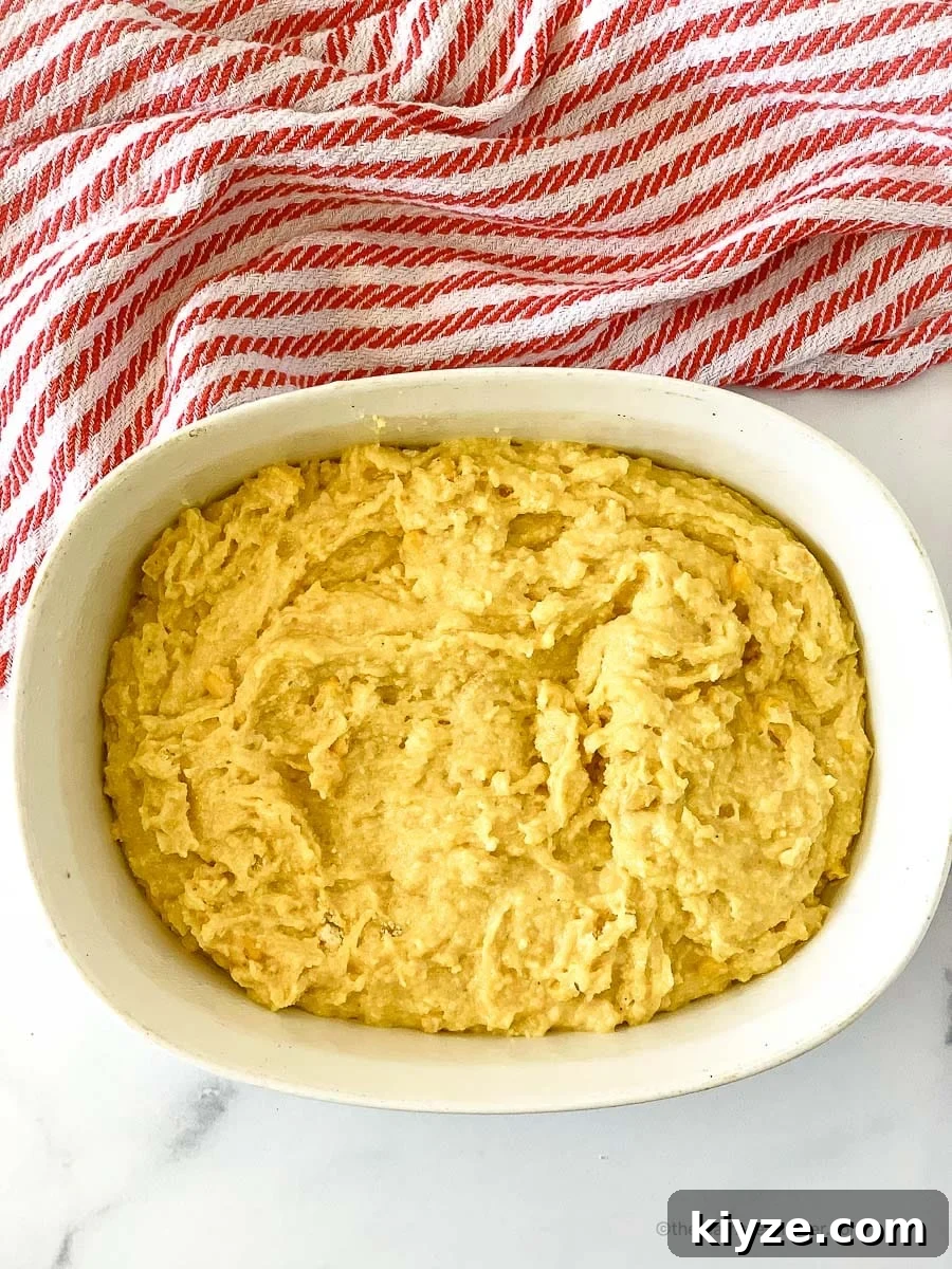 Jiffy Cornbread with Creamed Corn Casserole Recipe 8 Jiffy cornbread with creamed corn in a casserole ready to bake.