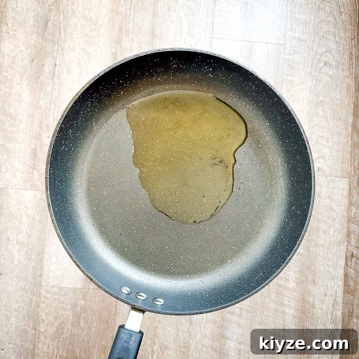 Cajun Blackened Chicken Tenders with Zesty Dipping Sauce 5 A frying pan with a drop of oil in it.