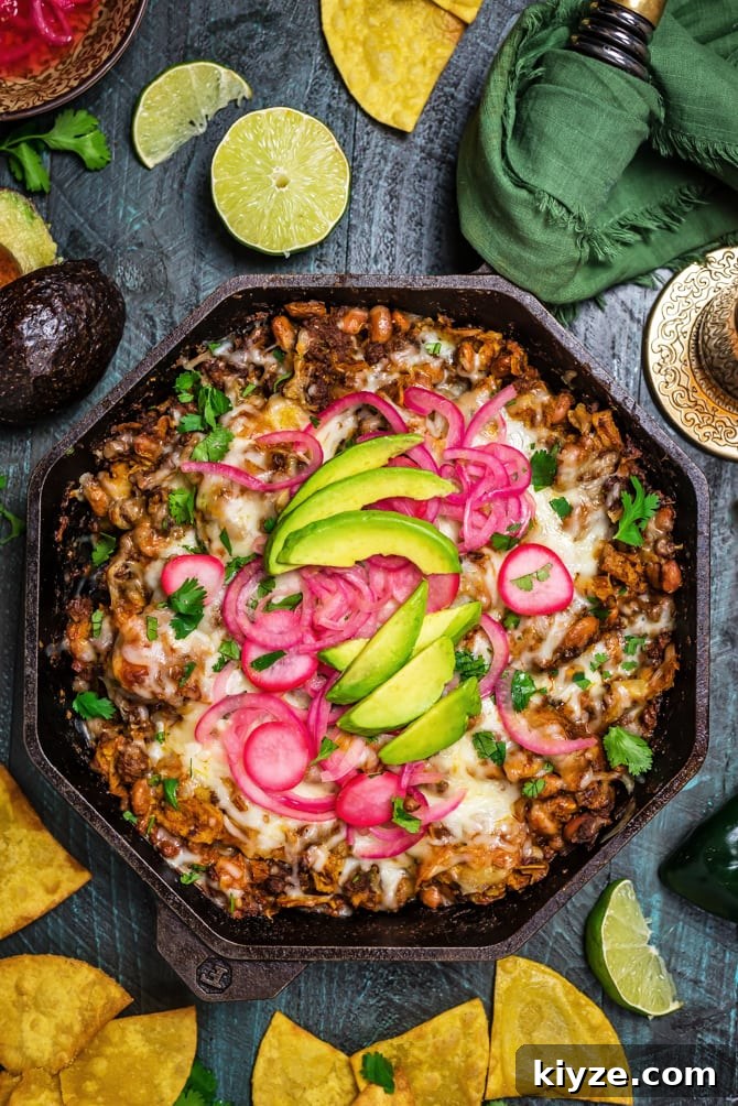 One-Pan Cheesy Enchilada Skillet Recipe 7 Easy Enchilada Skillet served with pickled onions and cilantro