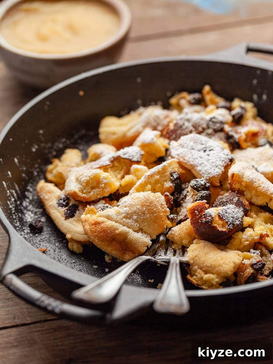 Gluten-Free Kaiserschmarrn Recipe: Fluffy Austrian Pancake Dessert 8 a pan of gluten free kaiserschmarrn with apple sauce