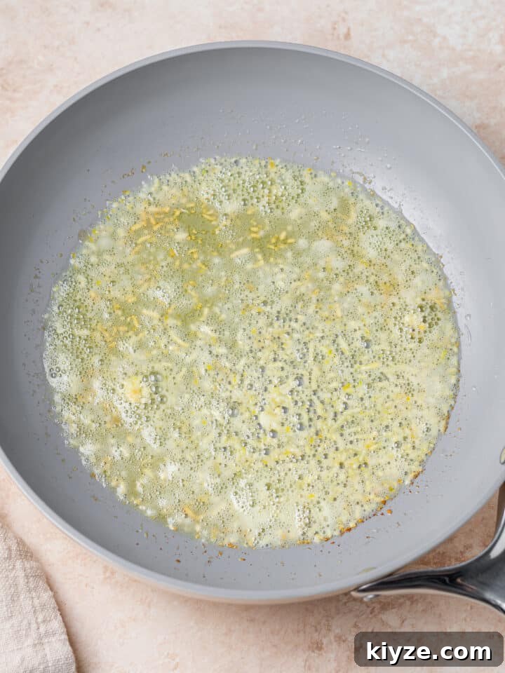sautéing garlic in a skillet with butter and olive oil