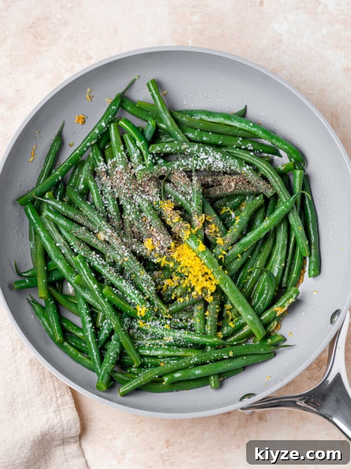 lemon zest, salt and pepper tossed in with the green beans and garlic butter