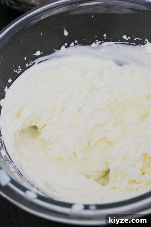 No-Bake Marble Cheesecake Recipe: Creamy Swirl No-Bake Cake 8 whipped cream in a bowl.