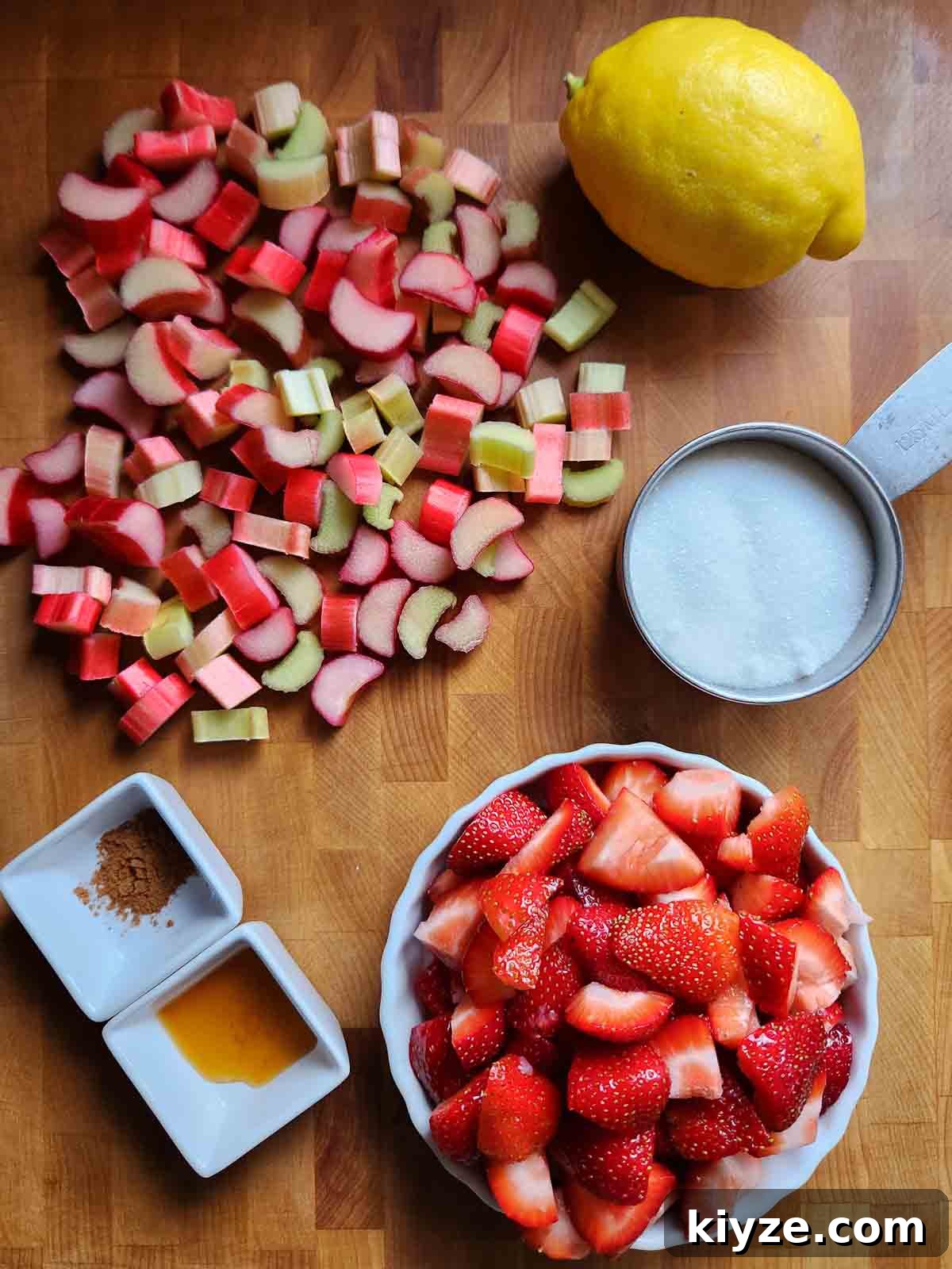 Small-Batch Strawberry Rhubarb Jam Recipe for Preserving Summer Flavor 3 Overhead of ingredients for fruit jam on a wood cutting board.