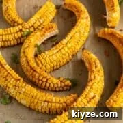 Crispy Corn Ribs Recipe (Corn Riblets) 12 Corn ribs on a cutting board.