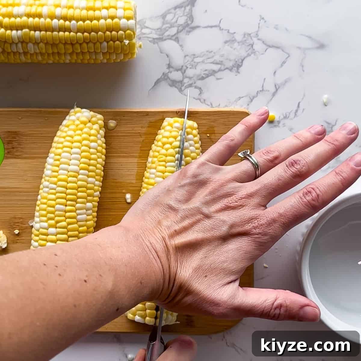 Crispy Corn Ribs Recipe (Corn Riblets) 5 Cutting the corn on the cob.