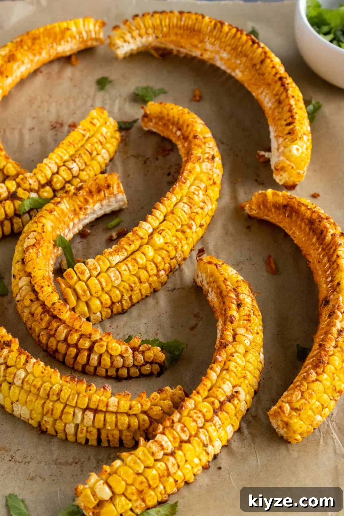 Crispy Corn Ribs Recipe (Corn Riblets) 8 Corn on a cutting board.