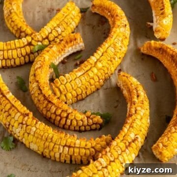 Crispy Corn Ribs Recipe (Corn Riblets) 9 Corn ribs on a cutting board.