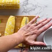 Crispy Corn Ribs Recipe (Corn Riblets) 10 Cutting the corn on the cob.