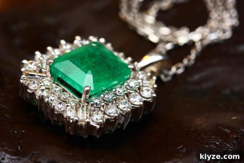 Chunky diamond pendant necklace set with a jade green stone