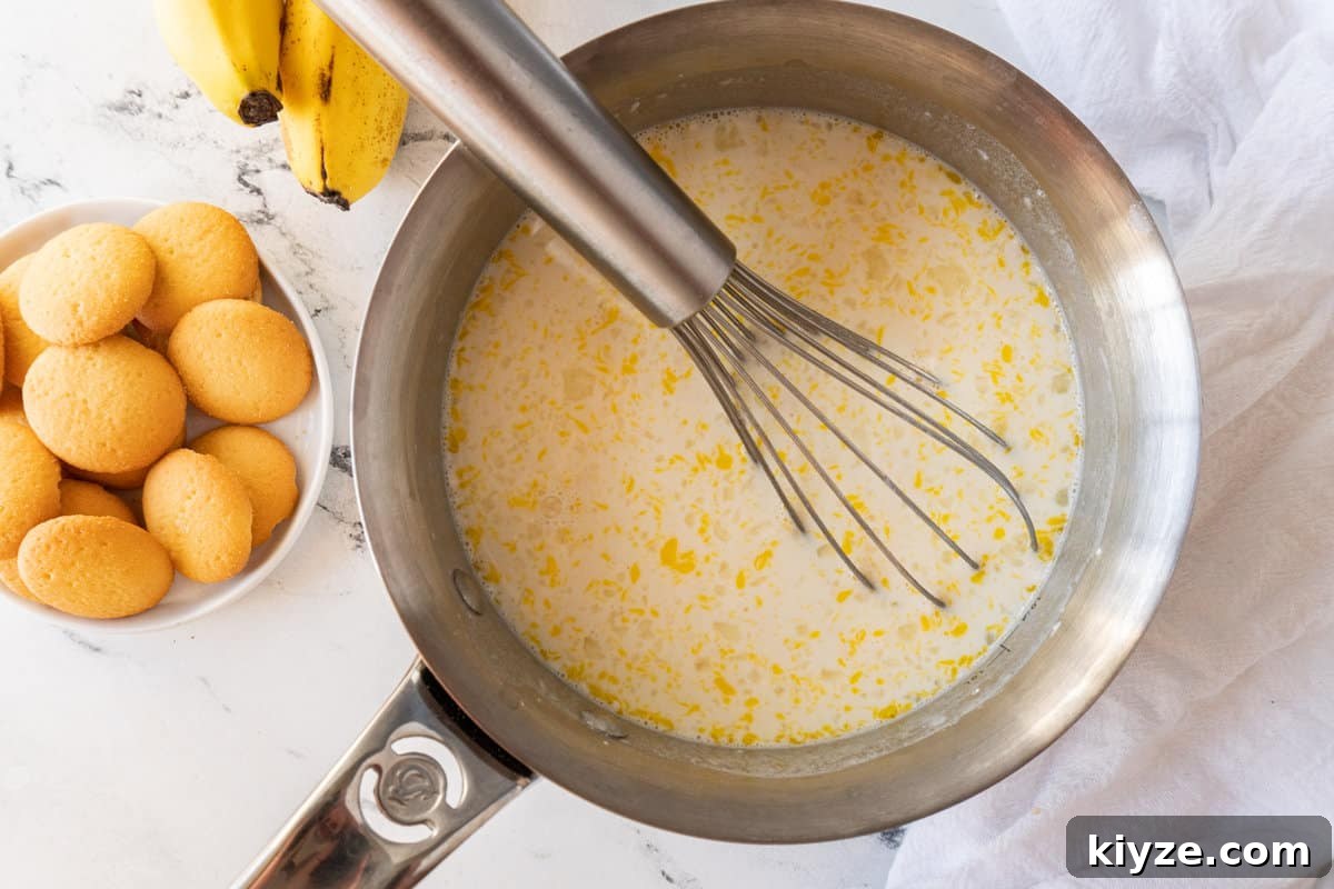 whisking all pudding ingredients together in saucepan.