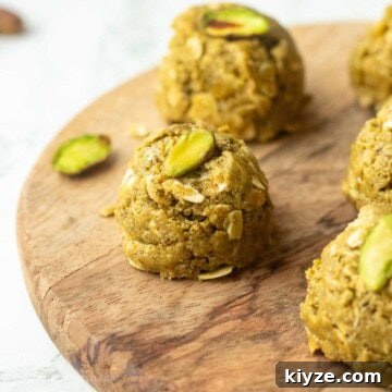 Pistachio protein ball on wooden board.