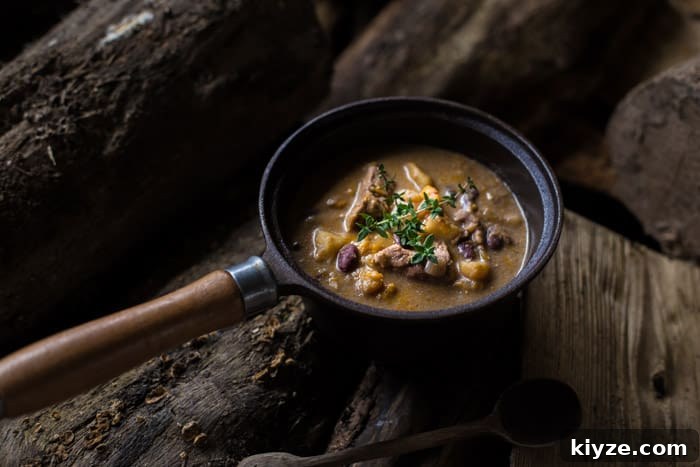 Caribbean Pepperpot Stew Made in the Slow Cooker 3 Slow Cooker Pepperpot Stew recipe cooked in a pan on a piece of wood