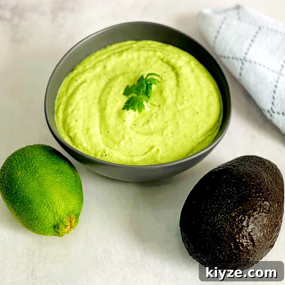 Creamy Avocado Lime Ranch Dressing Recipe 2 avocado lime ranch dressing, a lime, and an avocado