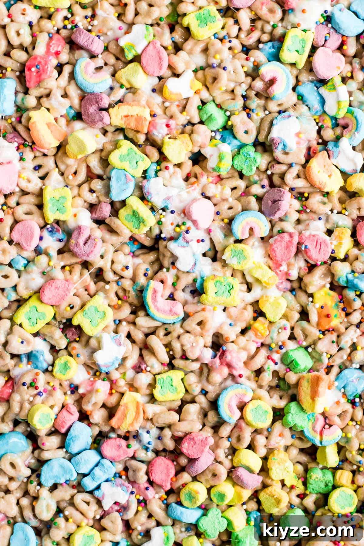 Lucky Charms Treats Recipe: Crispy Marshmallow Snack Bars 2 close up of the top of the luck charms bars in pan