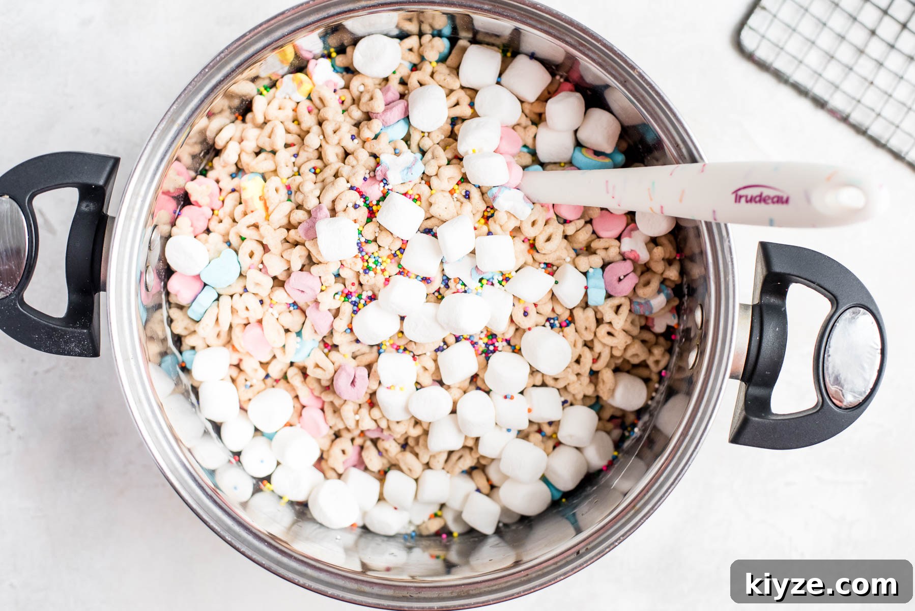 Lucky Charms Treats Recipe: Crispy Marshmallow Snack Bars 4 lucky charms cereal, sprinkles, and more marshmallows added to pot