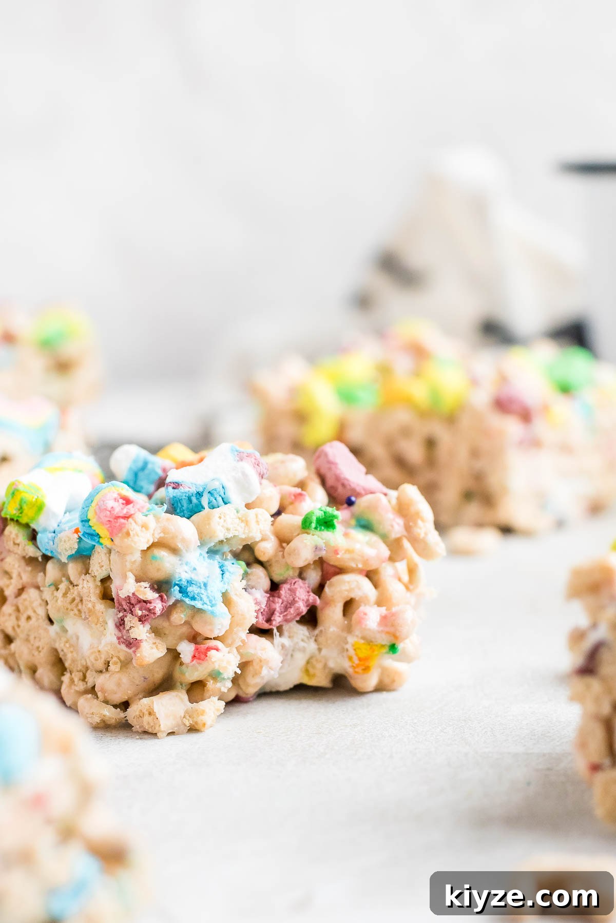 Lucky Charms Treats Recipe: Crispy Marshmallow Snack Bars 9 close up bitten treats bar
