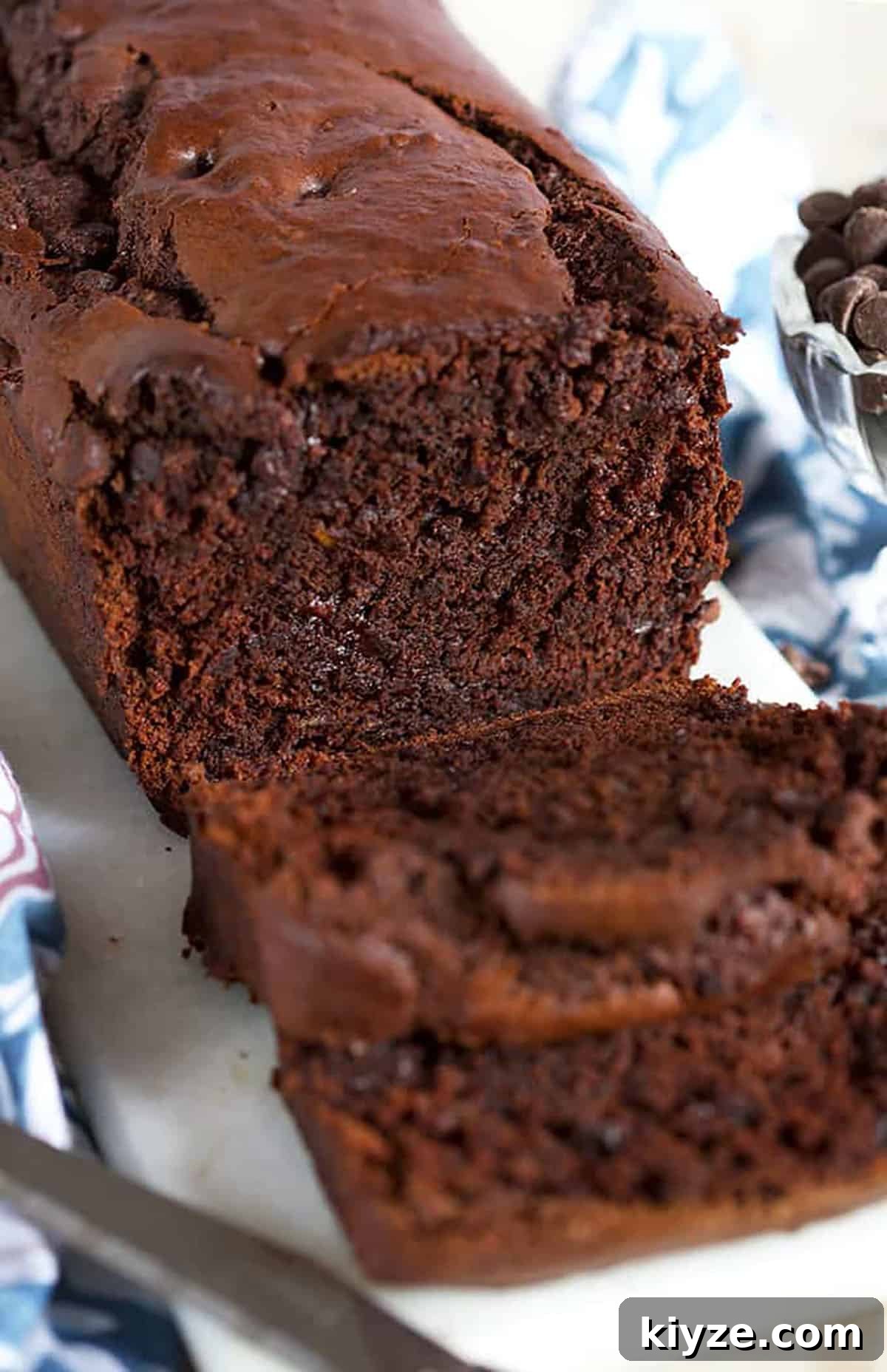 chocolate banana bread with melted chocolate chips inside.